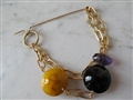 Maak een broche met zilver of gouddraad
